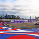 Formula E cars race against the backdrop of the New York Skyline